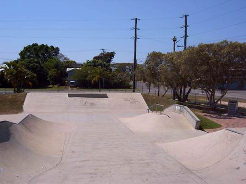 Concrete skate bowl and banks with a rail at a regional Queensland skatepark