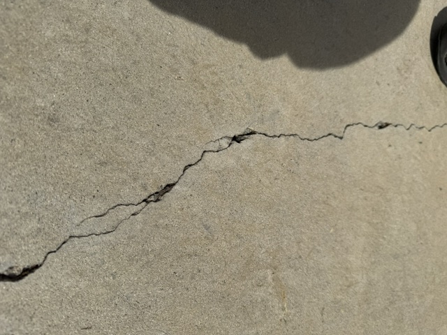 Concrete cracking in a skatepark riding surface